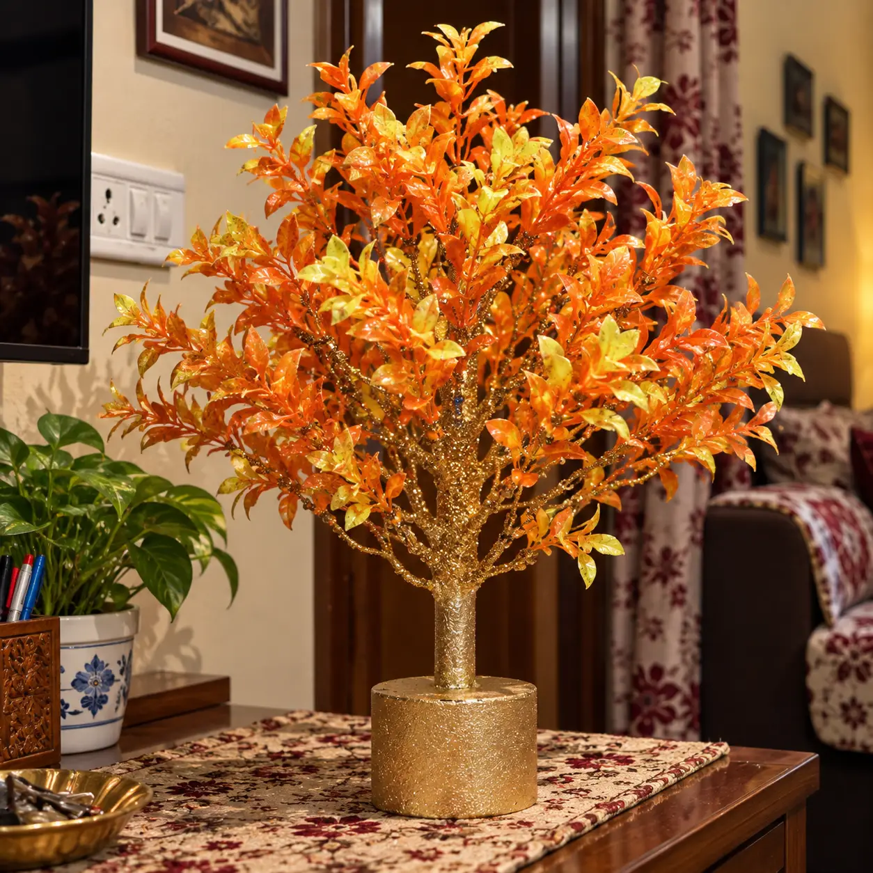 AARAYANA Agnira Luxe orange golden artificial tree with sculpted golden trunk